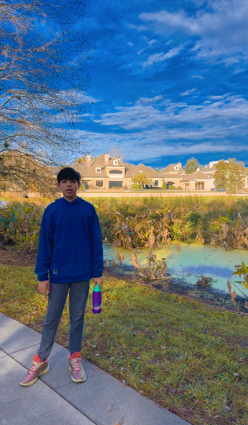 Boy standing by the lake in Celebration Florida