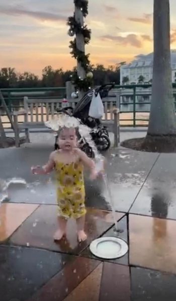 Child playing at the Celebration water playground near Lake Rianhard in Celebration Florida